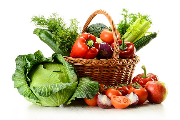 Vegetables in wicker basket Composition with raw vegetables and wicker basket isolated on white basket of fruit stock pictures, royalty-free photos & images