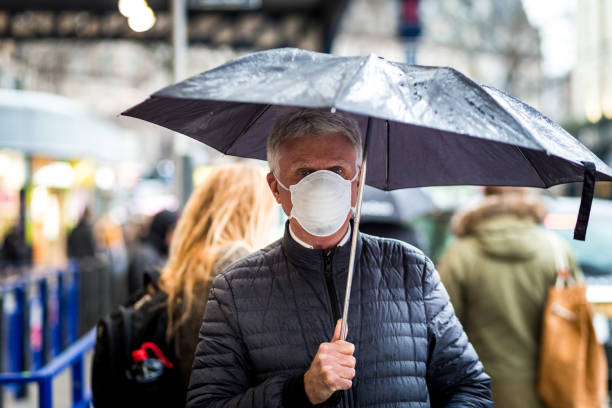 istock Senior man wearing protective face mask outdoors in the city 1211119269