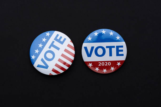 istock Vote election badge button for 2020 background, vote USA 2020 1211119338