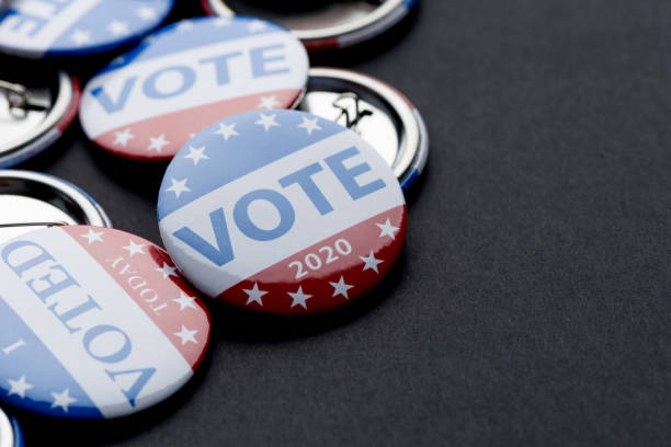 istock Vote election badge button for 2020 background, vote USA 2020 1211119341