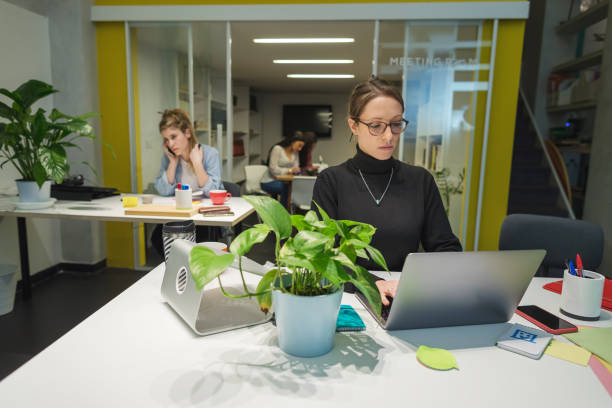istock New business startup: all women team work together in coworking office 1211122783