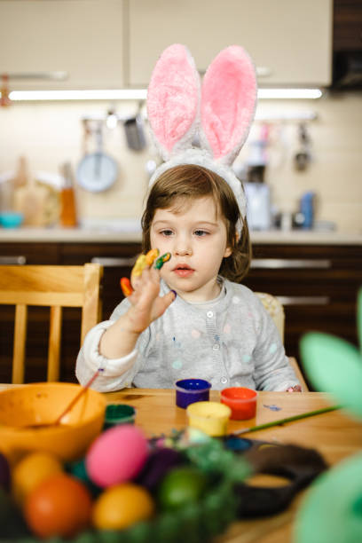 istock Well she didn't expect such a mess after finger painting 1211127974