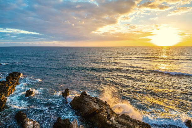istock Sun shining over Alghero rocky shore at sunset 1211129981