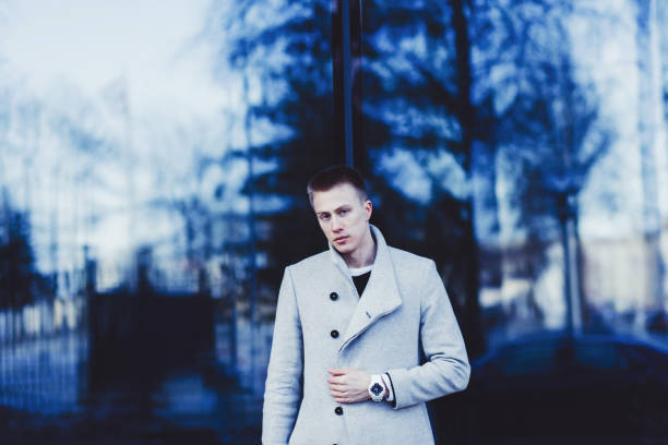 istock man wearing coat and watch 1211132346