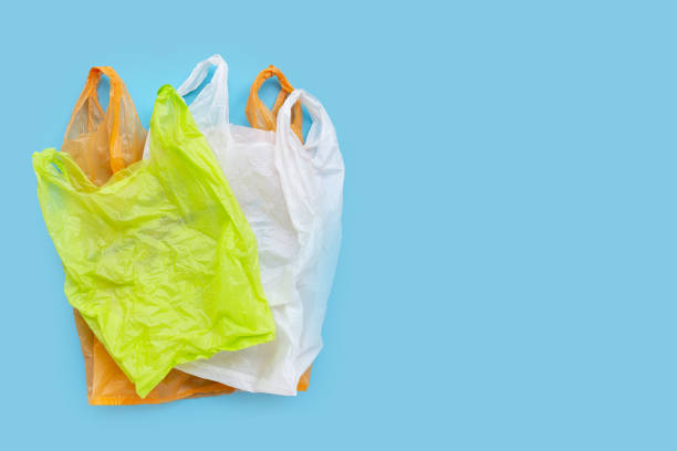 istock Colorful plastic bags on blue background. 1211137411