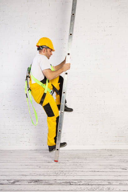 istock Irresponsible use of a ladder during construction works. 1211140689
