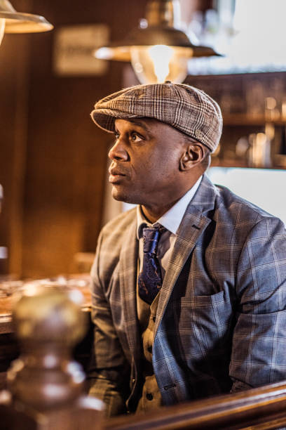 istock Black man in a Vintage public house scene 1211146325