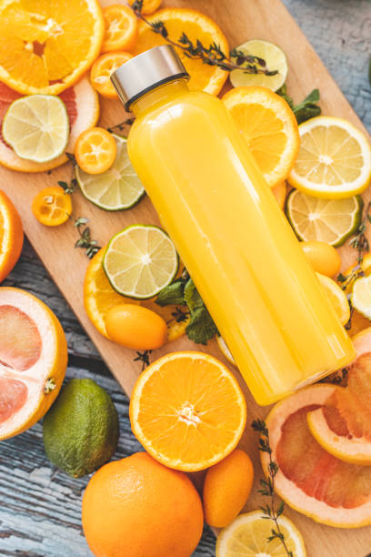 istock Orange juice and slices of citrus fruit on cutting board 1211146439
