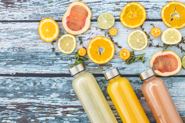 istock Bottles of fresh citrus juice 1211147451