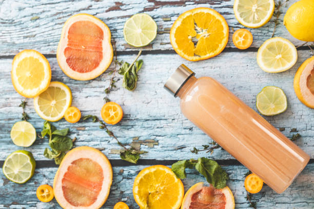 istock Grapefruit juice and slices of citrus fruit 1211147753