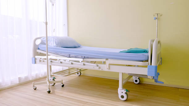 istock Isolated hospital bed at hospital room. 1211147836