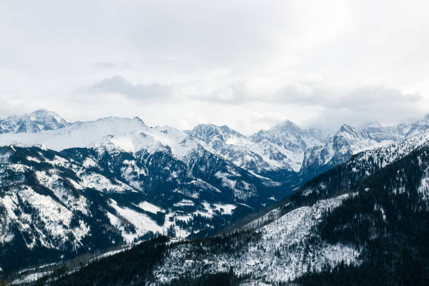 istock Panorama of snow capped mountains 1211148975