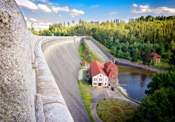 White water overspill run off on the stark sunlit concrete wall of Llys y Fran Reservoir Dam, Pembrokeshire, Wales, UK