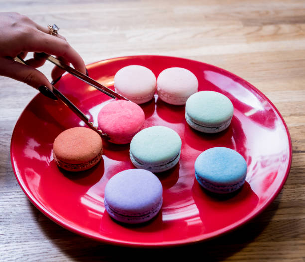istock French colorful macarons on a red plate. Restaurant. 1211151468