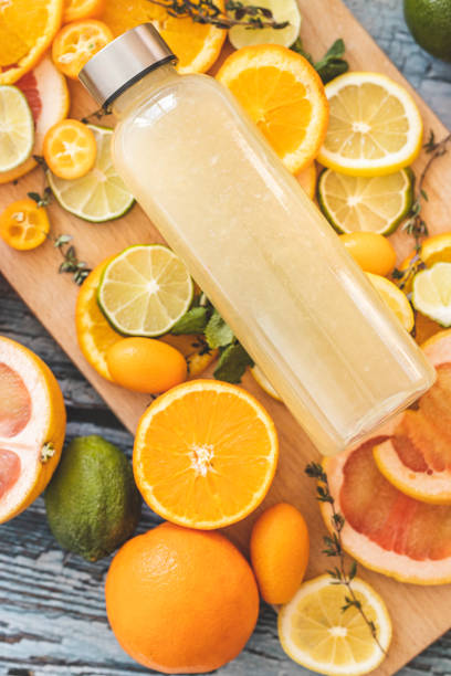 istock Lemonade and slices of citrus fruit on cutting board 1211152396