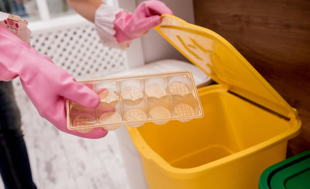 istock Young girl sorting garbage at the kitchen. Concept of recycling. Zero waste 1211153807