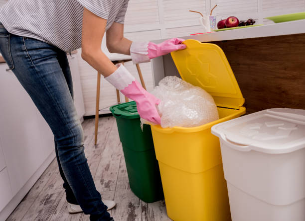 istock Young girl sorting garbage at the kitchen. Concept of recycling. Zero waste 1211154468