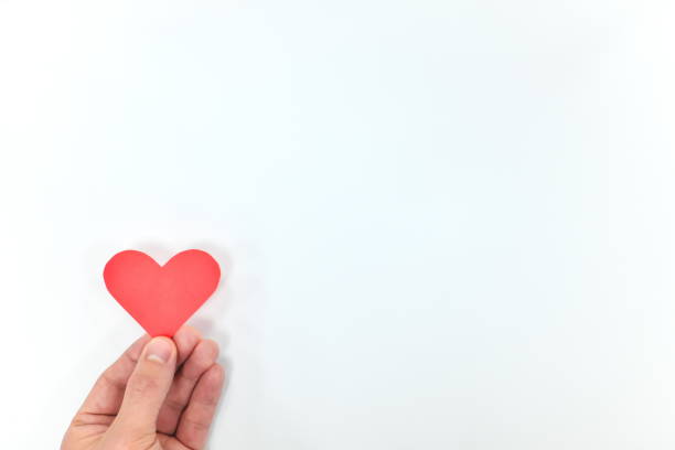 istock Hand holding a red heart shape. Kindness concept. 1211154611