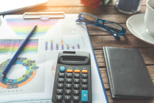 istock Excel graph with Spreadsheet Document showing Information Financial Startup Concept. Financial Planning making Accounting Database Report. Graphs and chart on screen with stationery set business stuff 1211154795