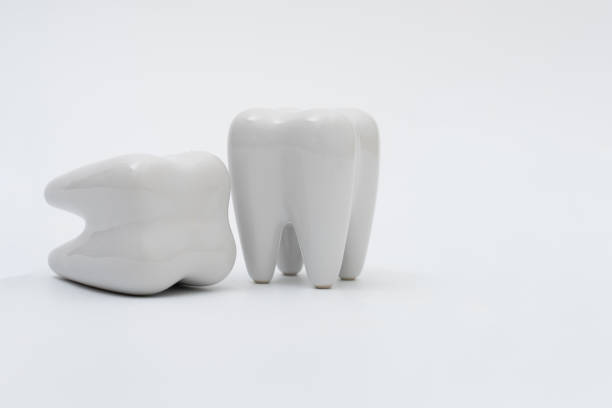 istock tooth dentist mirror on white background 1211154919