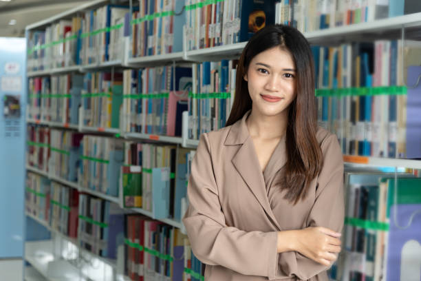 istock In the library,Asian student search book at shelves. 1211158055