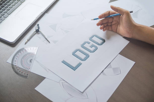 istock Graphic designer creative design sketch drawing logo Trademark brand Workspace 1211158793