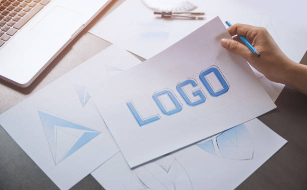 istock Graphic designer creative design sketch drawing logo Trademark brand Workspace 1211158794