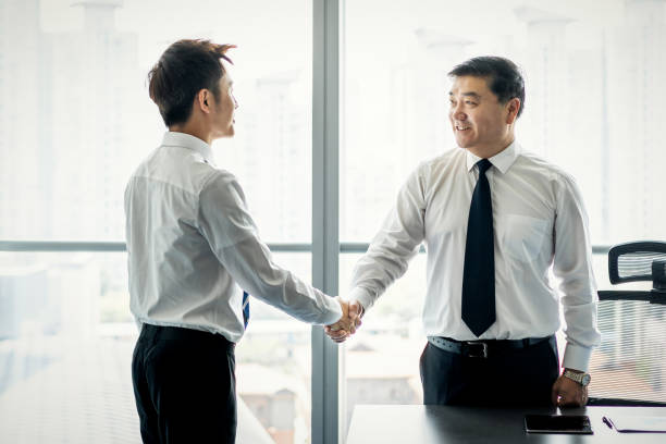 istock Business people shaking hands 1211161193