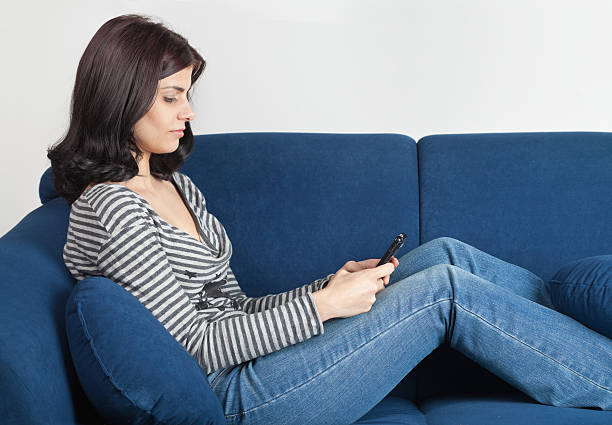 istock Young woman messaging with her smartphone 121116262