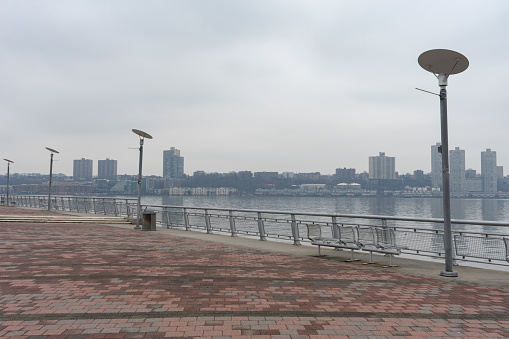 No people on Pier I along the Hudson River in the Lincoln Square neighborhood of New York City on a foggy day