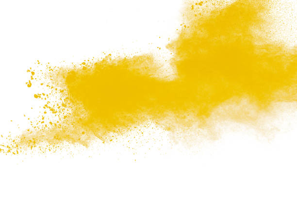 istock Yellow dust particles explosion on white background.Yellow powder dust splash. 1211163074