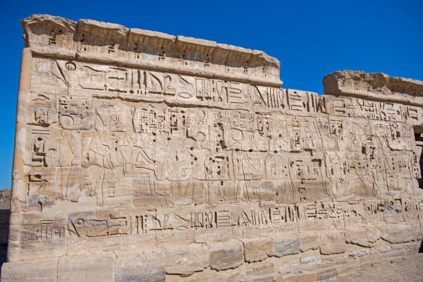 istock Hieroglyphic carvings on an ancient egyptian temple wall 1211163269