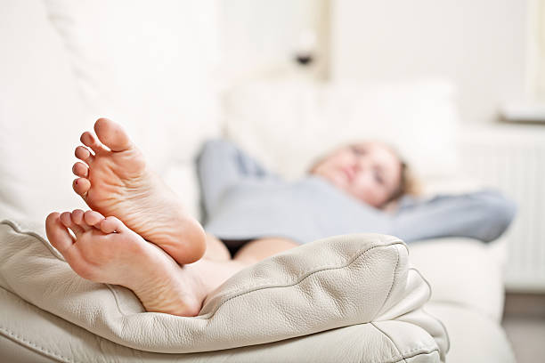 istock Young woman lying on sofa 121116453