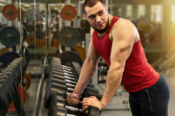 istock Guy working out in the gym. 1211164970