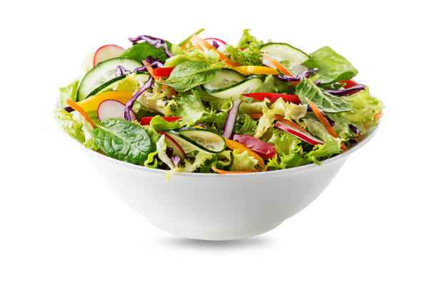 Green lettuce salad with mixed vegetables Green lettuce salad with fresh vegetables isolated on white background salad bowl photos stock pictures, royalty-free photos & images