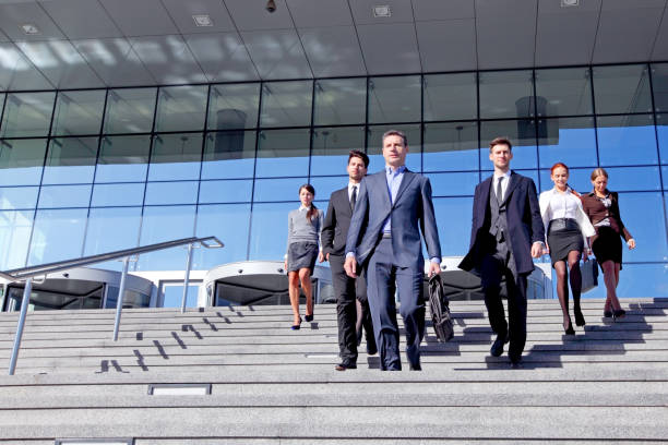 istock Business people walking the stairs 1211166261
