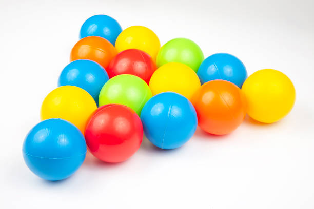 istock Colored plastic balls on white background. leisure and game items. round objects 1211167738