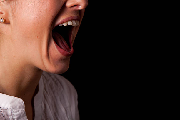 istock Closeup of woman face shouting 121116857