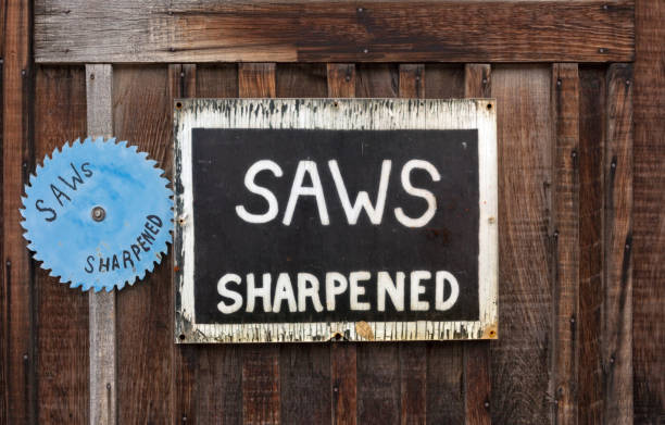 SAWS SHARPENED Signs - fotografia de stock