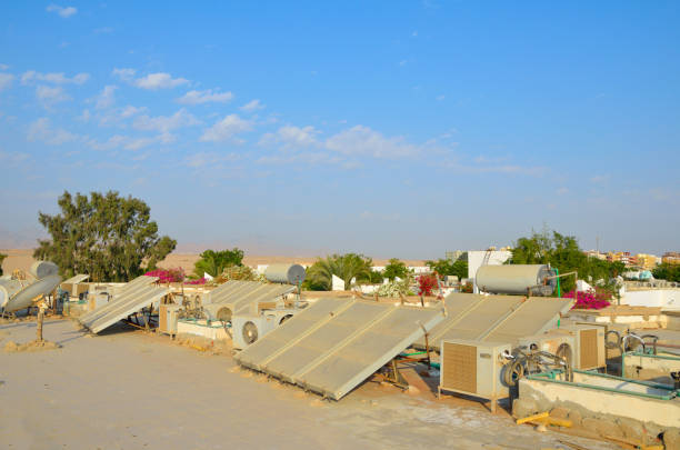 istock Solar PV modules and solar hot water panels mounted on rooftops. In Egyptian hotel 1211170512