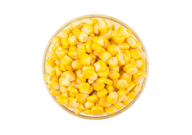 istock Canned corn seeds in glass bowl isolated, top view 1211171474