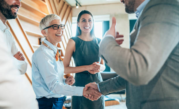 Handshake of business People Cheerful Business people shaking hands in the office coalition photos stock pictures, royalty-free photos & images