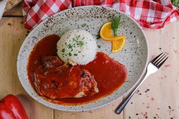 istock Steak in tomato sauce with rice ball on side 1211172810