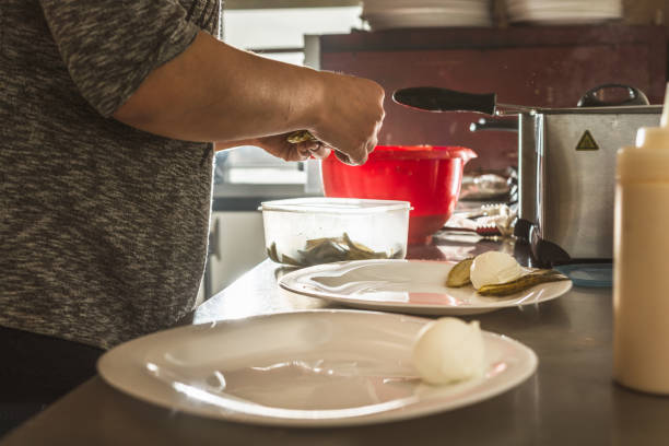 istock Woman preparing food in kitchen 1211172836