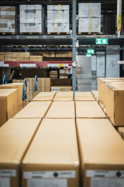 istock Stack of cardboard boxes in smart warehouse industry logistic. 1211174602