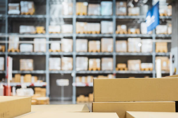 istock Stack of cardboard boxes in smart warehouse industry logistic. 1211174624