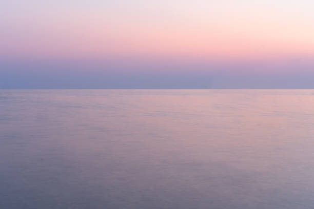 istock Sunset into the sea with twilight sky 1211174632