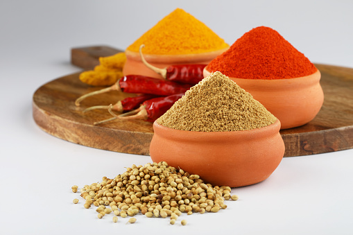 indian spices, colour full spices Chilli,Turmeric, coriander powder in terracotta bowls