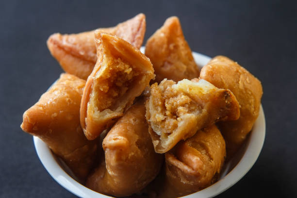 istock Gujiya  Samosa an Indian Holi special snacks 1211177128
