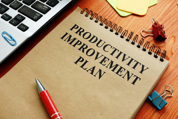 istock Productivity Improvement Plan near laptop in the office. 1211177564